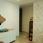 4 BHK Lodha Marquise Lower Parel Hexagon Mirror White Console Textured Accent Wall Foyer