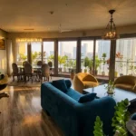 4 BHK Lodha World Crest Lower Parel Teal Sectional Yellow Armchair Chandelier Floor To Ceiling Cityview Living Dining