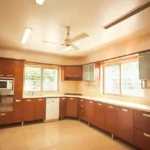 6 BHK Villa Clover Hills Kondhwa Pune Modular Kitchen Interior With Large Wooden Cabinets