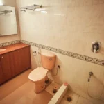 6 BHK Villa Clover Hills Kondhwa Pune Spacious Bathroom Interior With Wooden Vanity Counter