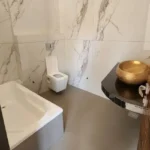 7 BHK Villa Panchgani Mahabaleshwar Interior Bathroom With Bathtub Wall Mounted Toilet Marble Finish Walls
