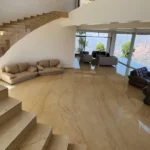 7 BHK Villa Panchgani Mahabaleshwar Interior Double Height Living Area With Staircase Sofa Seating Marble Flooring