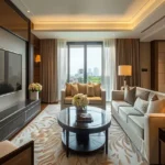 Ajmera Arham Malad West 3 BHK Cove Lit Ceiling Cream Sectional Floral Rug Round Dark Coffee Table Gold Cushion Cityview Living Room