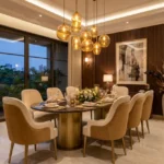 Anupama 6th Road Chembur 3 BHK Dining Area With Round Marble Dining Table Beige Dining Chairs Hanging Pendant Lights Wooden Wall Panels