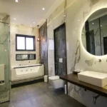 Asopalav Kandivali West 3 BHK contemporary bathroom with bathtub circular mirror glass shower partition