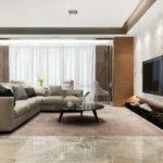 Aurum Q Islands Ghansoli Navi Mumbai 3 BHK White Marble TV Feature Wall Grey Sectional Round Dark Coffee Table Sheer Curtain Living Room