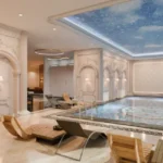 Claremont Gokuldham Goregaon East Indoor Swimming Pool Area With Lounge Seating Elegant Interiors Ambient Lighting And Luxury Amenities Space