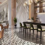 Isle Of Calm Powai cafe lounge with patterned flooring, bar seating and modern hospitality interiors