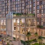 Isle Of Calm Powai clubhouse elevation with modern glass facade and landscaped podium amenities
