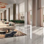 Isle Of Calm Powai grand entrance lobby with marble flooring, luxury seating and tall glass windows