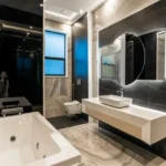 Kolte Patil Verve Bangur Nagar Goregaon West 3 BHK Bathroom Interior With Jacuzzi Bathtub Floating Vanity Round Mirror Wall Lighting