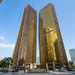 Lodha Marquis Lower Parel Gold Reflective Glass Twin Tower Blue Sky Street Level Exterior