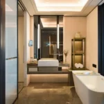 Luminaara 10th Road Khar West 3 BHK Luxury Bathroom With Freestanding Bathtub Floating Vanity Counter Large Mirror Glass Partition
