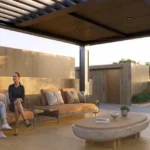 Luminaara 10th Road Khar West Rooftop Seating Area With Outdoor Sofa Wooden Deck Pergola Ceiling Coffee Table