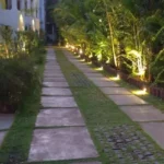 Magic Arr Estate Goa Landscaped Walkway At Night With Garden Lighting