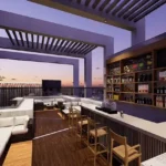 Mehta Marquina Goregaon East open air rooftop lounge with modern bar counter, outdoor seating
