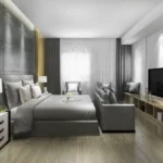 Oberoi Elysian Yashodham Goregaon East 3 BHK Luxury Bedroom Interior With Television Unit Sofa Seating And Elegant Lighting