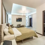 Oberoi Elysian Yashodham Goregaon East 3 BHK Spacious Bedroom Interior With Lounge Seating Elegant Decor