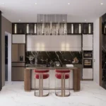 One Vara Goregaon East 3 BHK Dark Marble Backsplash Gold Island Chandelier Modular Kitchen
