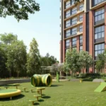 Piramal Revanta Mulund West Yellow Trampoline Tunnel Play Equipment Open Green Lawn Tower Side Kids Area