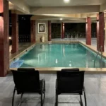R Paradise Tungarli Lonavala 6 BHK Villa Indoor Swimming Pool With Lounge Chairs