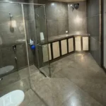 R Paradise Tungarli Lonavala 6 BHK Villa Bathroom With Spacious Shower And Storage Cabinets