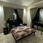 R Paradise Tungarli Lonavala 6 BHK Villa Bedroom With Balcony And Curtains