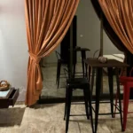 R Paradise Tungarli Lonavala 6 BHK Villa Living Area With Bar Table And High Chairs