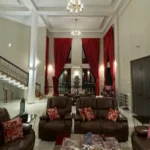 R Paradise Tungarli Lonavala 6 BHK Villa Double Height Living Room With Red Curtains