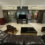 R Paradise Tungarli Lonavala 6 BHK Villa Living Room With TV Unit And Seating