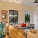 Villa Casa Brilhante Parra Goa 4 BHK Living Room With Pool View Cane Furniture Large Windows