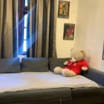3 BHK Kuvar House Colaba Kids Room with Daybed and Teddy Bear