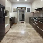 3 BHK One Avighna Park Modular Kitchen with Black Countertops