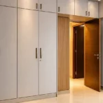 5 BHK Duplex Ashok Towers Parel Full Height White Cabinet Warm Lit Wood Entry Bedroom