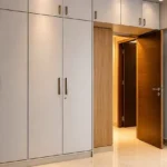 5 BHK Duplex Ashok Towers Parel Full Height White Cabinet Warm Lit Wood Entry Bedroom