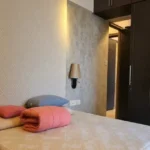 5 BHK Duplex Ashok Towers Parel Embossed Wall Warm Lit Compact Bedroom