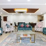 5 BHK Lake Superior Powai Spacious Living Room with Blue Sofas and Carpet