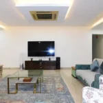 5 BHK Lake Superior Powai Living Room with TV Unit and Sofas