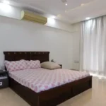 5 BHK Lake Superior Powai Master Bedroom with Pink Bedspread