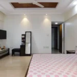5 BHK Lake Superior Powai Master Bedroom with TV and Dressing Mirror