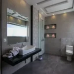Rishabraj Arham SV Road Goregaon West 3 BHK Dark Counter Patterned Wall Tray Ceiling Bathroom