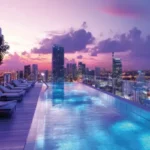 Ruparel Zinnia Borivali West Lit Skyline Purple Sky Teak Deck Rooftop Pool
