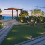 The Reserve Sector 11 Kharghar Ground Lit Pathway Pool Step Lush Garden Dusk Rooftop Terrace