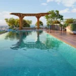 The Reserve Sector 11 Kharghar Turquoise Water Teak Deck Lush Green Skyline Infinity Pool
