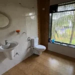 3 BHK Beach Villa Nagaon Bathroom with Garden View Window