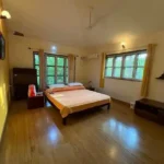 3 BHK Beach Villa Nagaon Bedroom with Large Windows and TV Unit