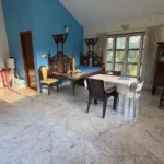 3 BHK Beach Villa Nagaon Dining Area with Blue Wall