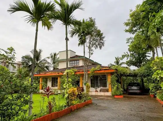 3 BHK Beach Villa Nagaon Front Elevation with Lawn and Palms