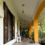 3 BHK Beach Villa Nagaon Verandah with Yellow Pillars