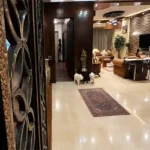 4 BHK Lake Front Solitaire Powai Spacious Living Room with Stone Accent Wall
